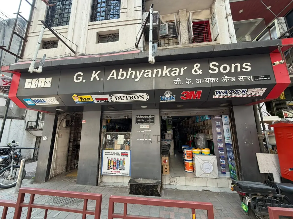 The G.K. Abhyankar & Sons shopfront on Laxmi Road, with the GKAS sign, the shop name in English and Marathi, and partner brand boards above the open entrance